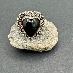 Black and Silver Heart-Shaped Ring with Intricate Design